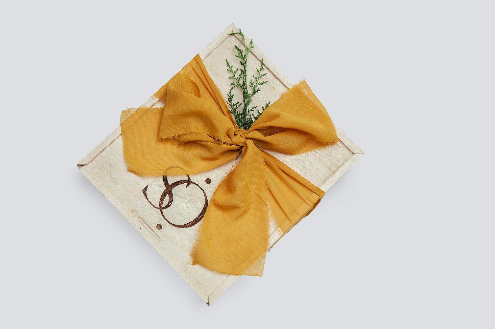 A gift tied with a golden ribbon