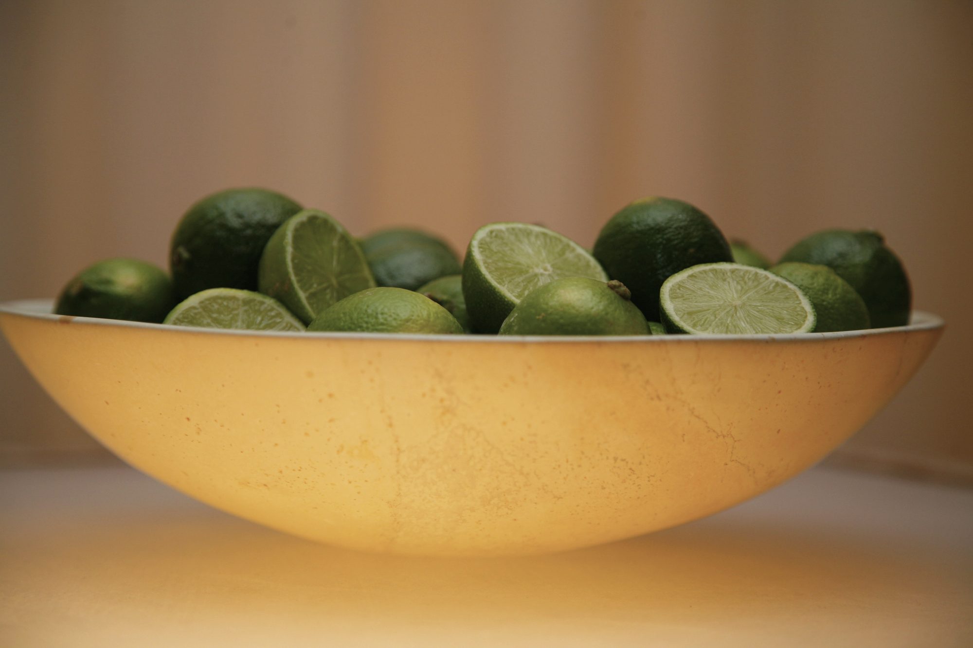 A bowl of limes — a still life by the studio